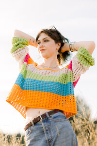 High school female senior posing in an open field