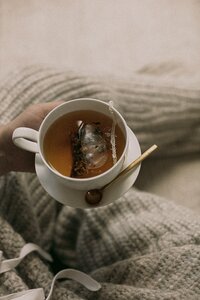Cup of tea sitting on a blanket