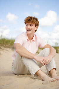 Senior portrait of a Plymouth high school student on a beautiful beach in Petoskey, Michigan