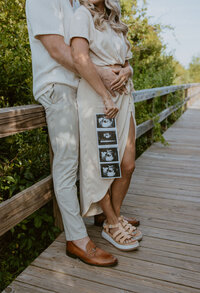 Maternity photograph on boardwalk in Charleston