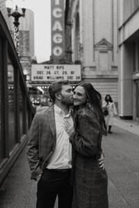 A couple kissing one another on the cheek