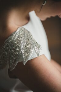 hand beaded feathers on wedding dress