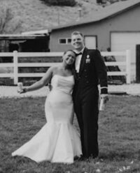 bride and groom in white and black photo