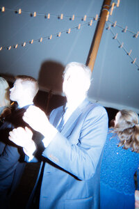 groom holding pocket watch