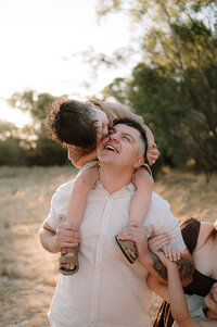 Father with their child on their shoulders at a Perth photo shoot.