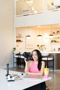 Sophie K. Hunter, Dallas brand and senior photographer, showcasing the best tools for entrepreneurs in her personal kitchen with her professional camera.
