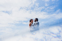 Couple with the sky reflected below them