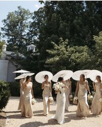 Wedding Photographer, wedding party holding parasols outdoors