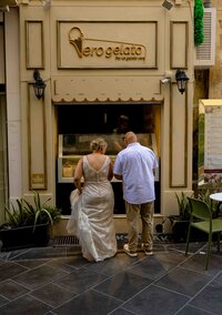 two people eloping in Malta getting Ice cream in the city of Valetta with a warm look and hue