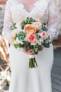 charlotte wedding photographers capture close up image of a bride's bouquet on her wedding day