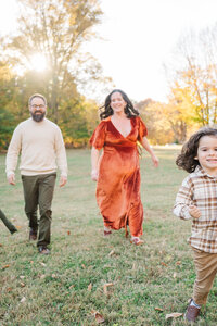 Engaged couple embrace during their engagement session at The Crescent Hill Reservoir