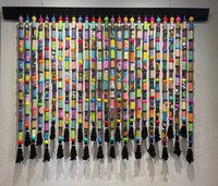 full-view-of-art-piece-hanging-in-gallery