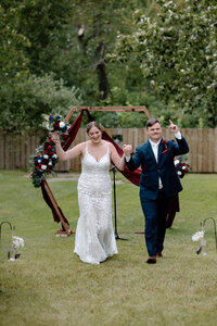 Bride and groom doing their grand exit after the ceremony