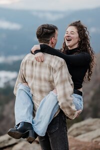 Denver Engagement Photographer, Couple dances after Colorado mountain proposal.
