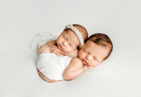 Newborn portrait captured with emotional, gentle lighting and serene fine-art styling in a luxury Guelph studio.
