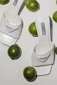 prada shoes surrounded by limes