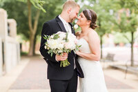 textured wedding bouquet with greens, whites, and purples at oaks lakeside wedding