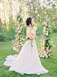 Bride in wedding dress holding bridal bouquet