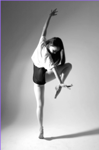 acro tumbling little girl in blue leotard