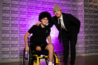 a Dallas Stars player posing with a teenage boy who is a pediatric cancer warrior