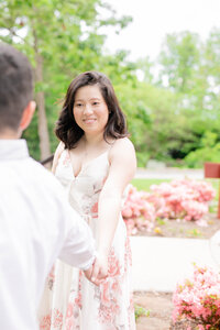 Liriodendron Mansion Wedding Photographer snaps a photo of a couple outside the mansion in the front gardens