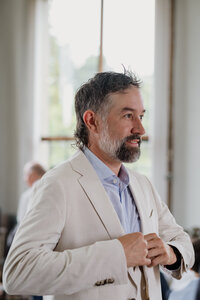 Groom getting ready at historic coastal New England wedding venue