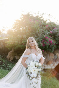 Bride Posing for a beautiful shot at al Palm Beach Luxury Wedding Venue. Photo by Maggie Alvarez Photography