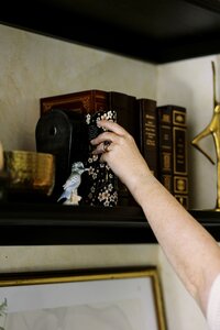 monica reaching for book