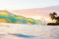 drone portrait of bride in large fluffy gown photographed on a maui beach at sunrise