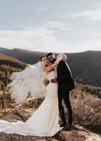 Bride and groom portrait on top of mountain in Colorado