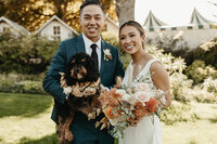 Wedding reception with neutral linens and airy green garlands organized by seattle wedding planners