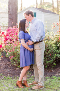 Expecting couple snuggled in close for their Richmond maternity session