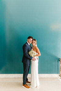Bride and groom smile at camera