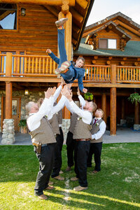 Jackson Hole videographer captures groom being thrown in air after Jackson Hole wedding