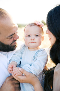 One year old baby with hands in the air taken by Sacramento Newborn Photographer Kelsey Krall Photography