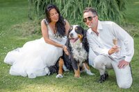 bride and groom with their dog