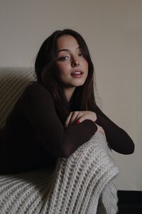 Portrait of woman posing on couch in albuquerque new mexico.