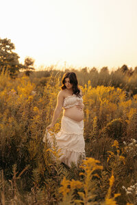 A beautiful maternity session in Appleton in the heart of summer. Wildflowers and a beautiful, pregnant mother in a field of flowers at sunset.