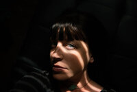 woman with dramatic shadows on face