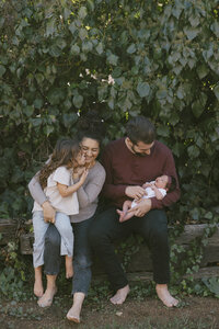 family snuggling and laughing