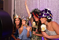 family posing in a photo booth