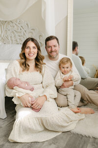 PrFamily of four at newborn photography session in Orange County