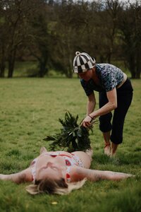 Whisking during a sauna session to stimulate circulation, detoxify the body, enrich the skin with natural oils, and enhance respiratory health through aromatherapy at Polhawn Fort.