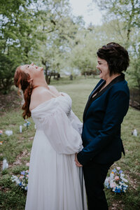Destination wedding photographer captures couple holding hands during intimate engagement photos