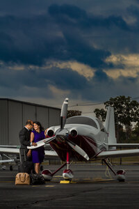 A striking mini session image of a woman in a black gown with her Great Dane striking a dramatic pose in Phoenixville.