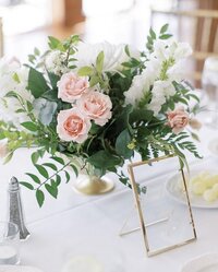 White and light pink floral wedding center piece by Prose Florals