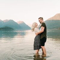 Utah Wedding Photographer captures man and woman standing in water during engagement photos