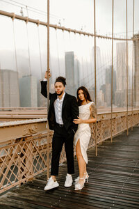 NYC engagement session on the Brooklyn Bridge at sunrise.