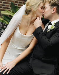 Newlyweds sharing a joyful kiss, full of love and sparkling energy