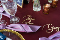 Luxurious wedding table setting with custom name decor, designed by a full-service wedding planner in Raleigh.